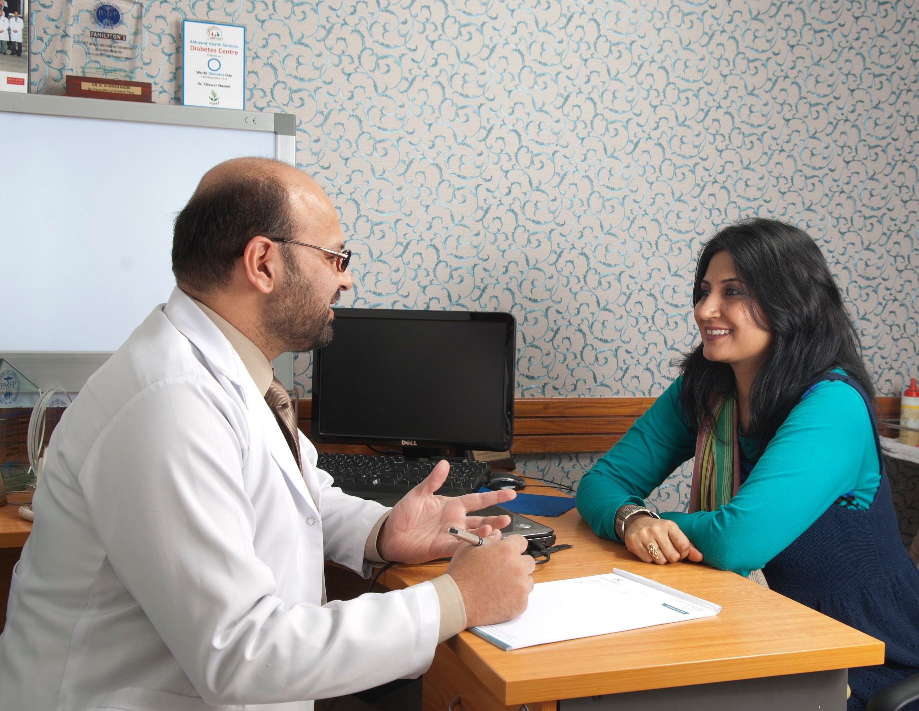 Dr. M. Khawar Nazir during a consultation with a patient at
Boston Aesthetics, 15-A, Hali Road, Lahore, Punjab, Pakistan | 03334046479
