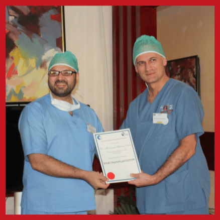 Dr. M. Khawar Nazir is being awarded Hair Tranplant training certification from his mentor and senior hair transplant surgeon .