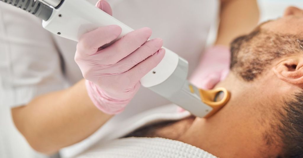 Laser hair removal in Lahore being performed on a man's beard and neck area to reduce unwanted facial hair and ingrown hairs safely and effectively